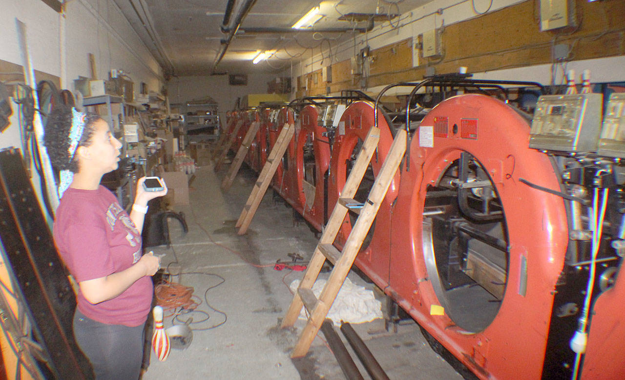 Michael Lang | The Vidette Brooke Chapman explains how a ceiling leak in early May fried the electronic components behind the scenes at Bulldog Lanes in Montesano. (Photo taken Aug. 10, 2018)