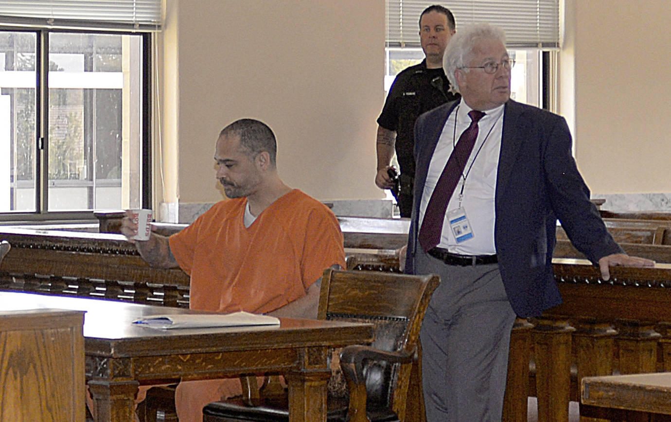 DAN HAMMOCK | THE DAILY WORLD                                Isaac J. Gusman sits beside his attorney, David Arcuri, on Thursday before Superior Court judge Ray Kahler delivered not guilty verdicts on four charges of kidnapping and attempted kidnapping. Kahler found Gusman guilty only of unlawful imprisonment related to a May attack on a woman in Montesano.