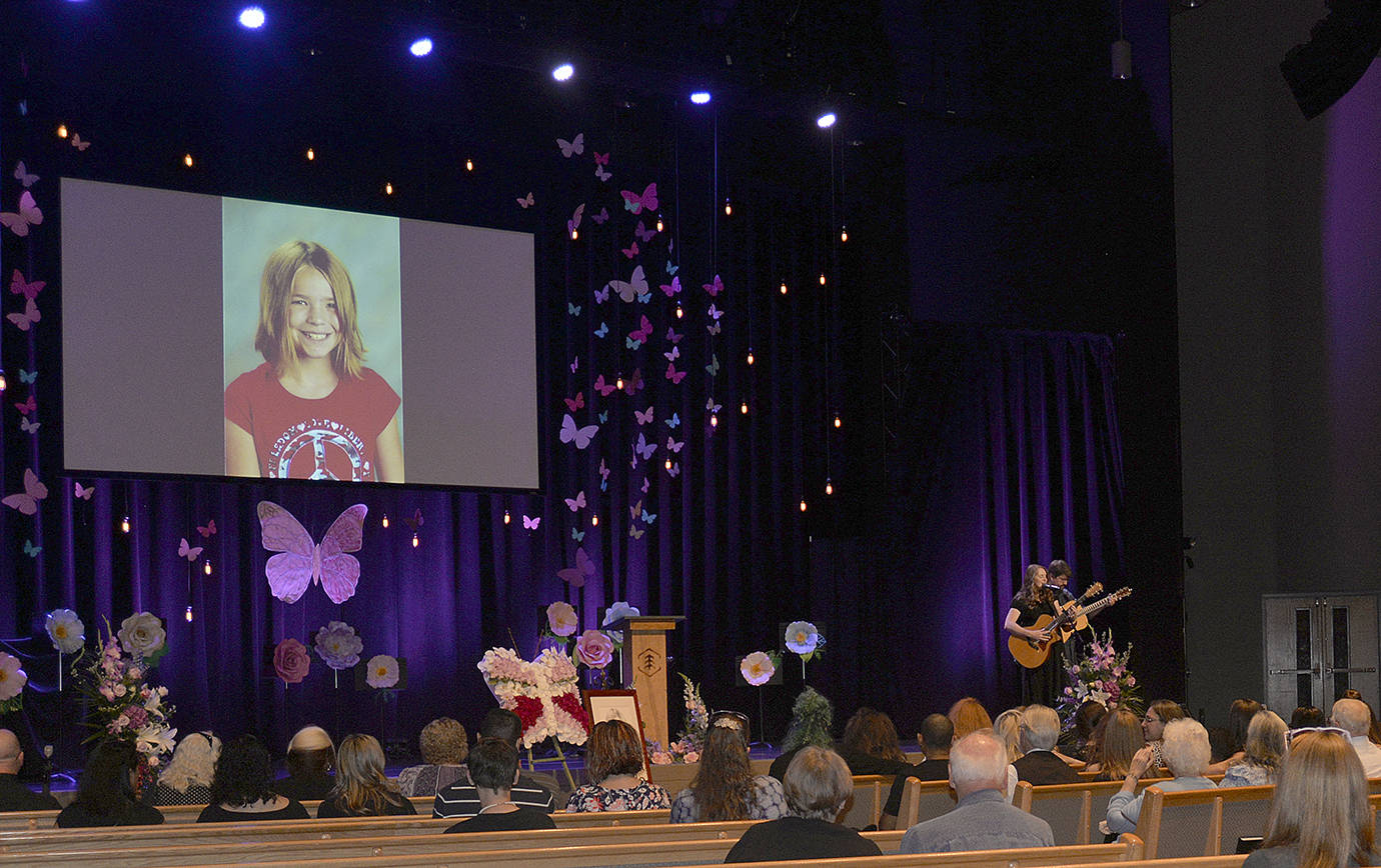 DAN HAMMOCK | THE DAILY WORLD                                Aberdeen singer/songwriter Ericka Corban performed at the Lindsey Baum memorial service in Olympia Saturday. Here she sings Eric Clapton’s “Tears in Heaven” accompanied on guitar by Dan Stone; later she played “Amazing Grace.”