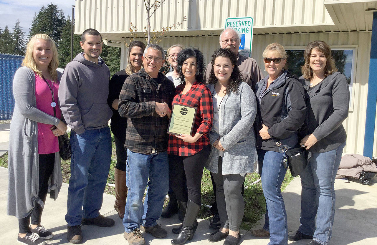 Members of the Elma Chamber of Commerce present its Business of the Quarter award to Poston Insurance Agency. Pictures from left are Kristi Christensen, Ryan Phillipi, Bernadette Bower, Scott Phillipi, Stephanie Rangel, Michelle Poston, Lisa Zimmerman, Rick Jensen, Jill Warne, Connie Brown. Photo courtesy Elma Chamber of Commerce.