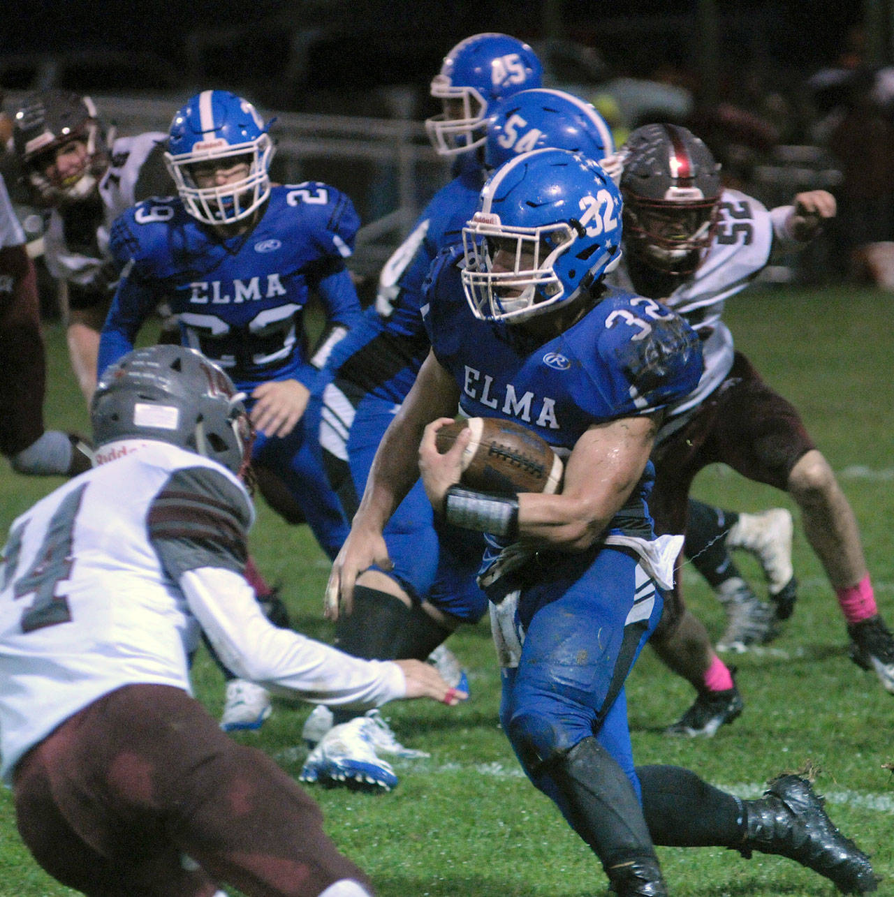 Elma’s Taitum Brumfield looks for daylight on a run against Hoquiam on Friday night. (Hasani Grayson | The Daily World)