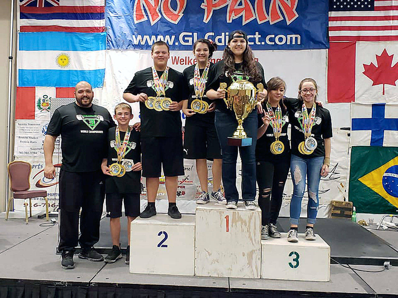 Team Evolution had plenty of hardware to lug home, including a team title, after winning multiple events at the WABDL World Championships in Las Vegas, Nevada last week. Pictured are (from left): Head coach Shaun Straka, Trey Anderson, Nate Ivey, Mataya Straka, Tyara Straka, Genevieve Sawyer and Iris Singleton. (Photo by Sarah Navarre)