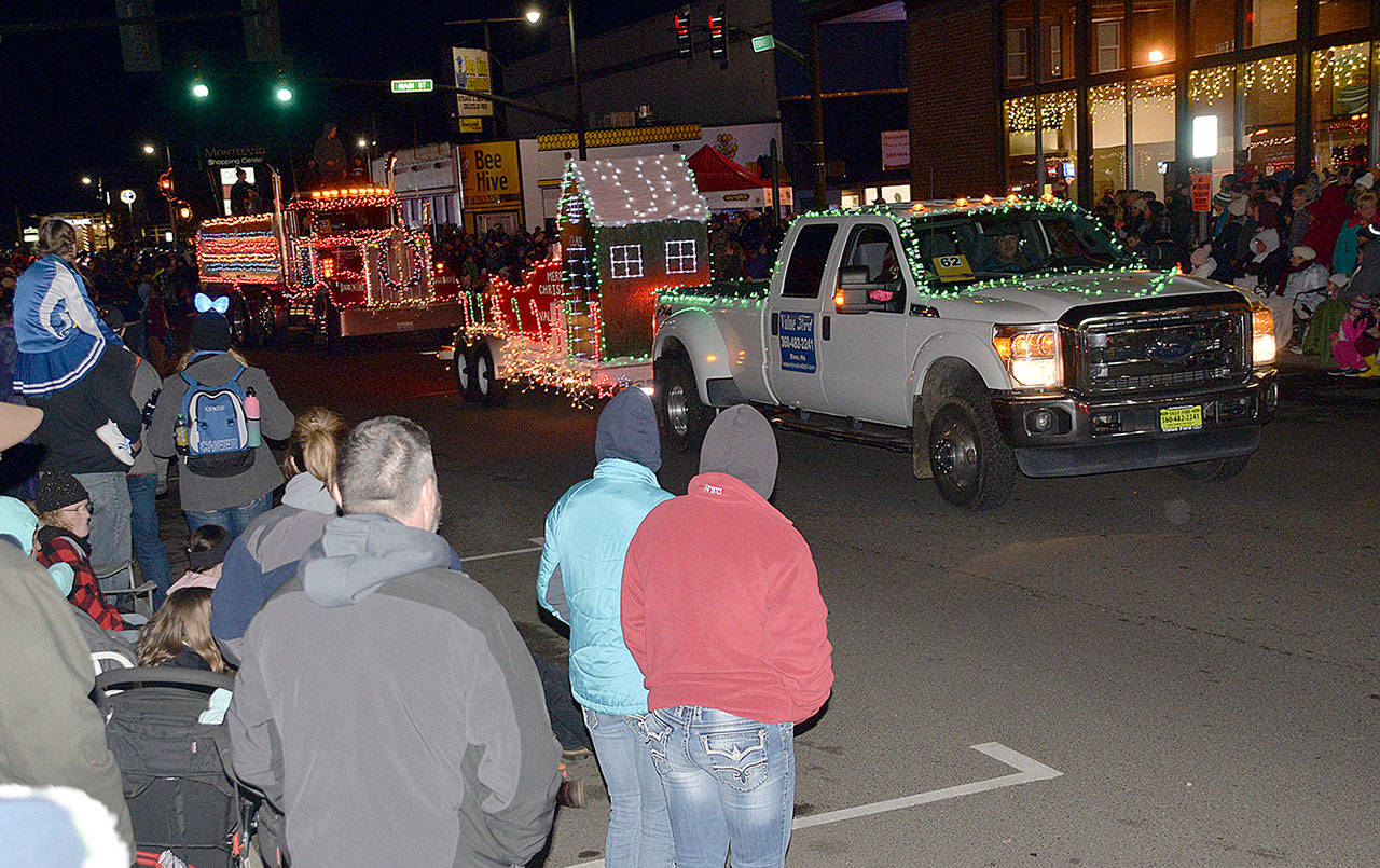 DAN HAMMOCK | GRAYS HARBOR NEWS GROUP Hundreds of people lined Main Street and Pioneer Avenue in Montesano Saturday evening for the annual Festival of Lights parade.
