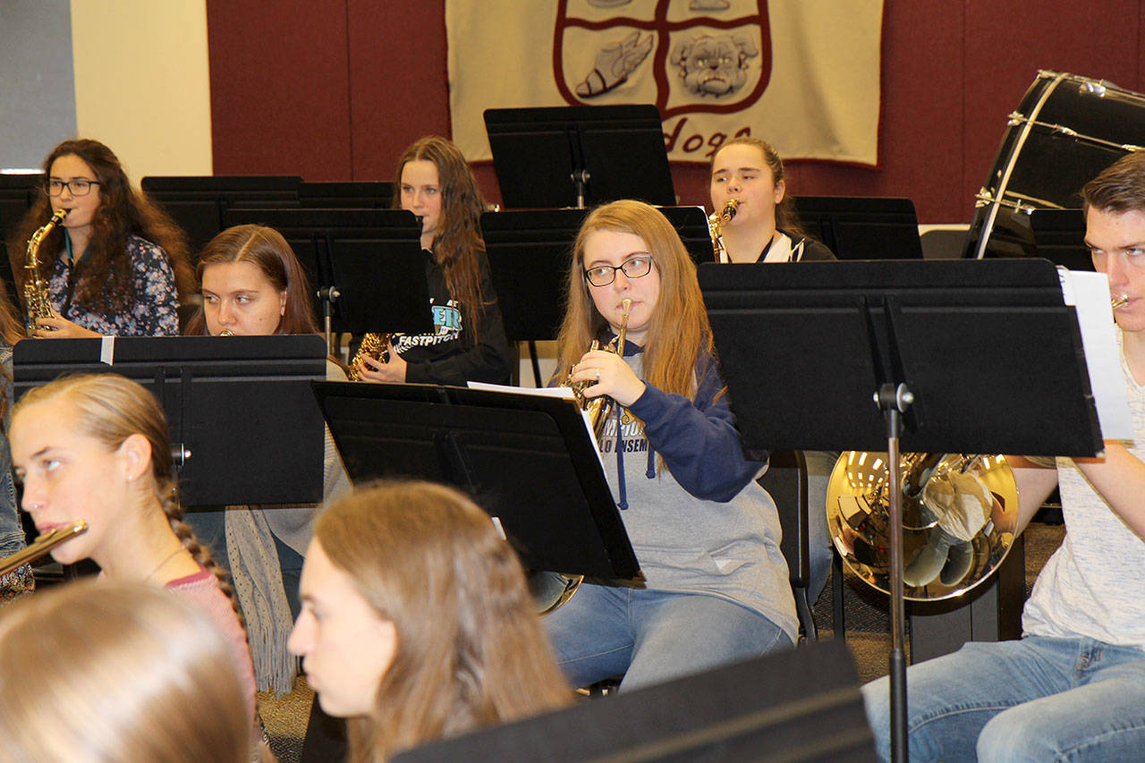 Hero Winsor, center, plays French horn during class Monday at Montesano High School. She recently was invited to perform with two Northwest honor bands: one at Pacific Lutheran University next month in Tacoma, and for the National Association for Music Educators Northwest region meeting in February in Portland. Michael Lang | Grays Harbor News Group