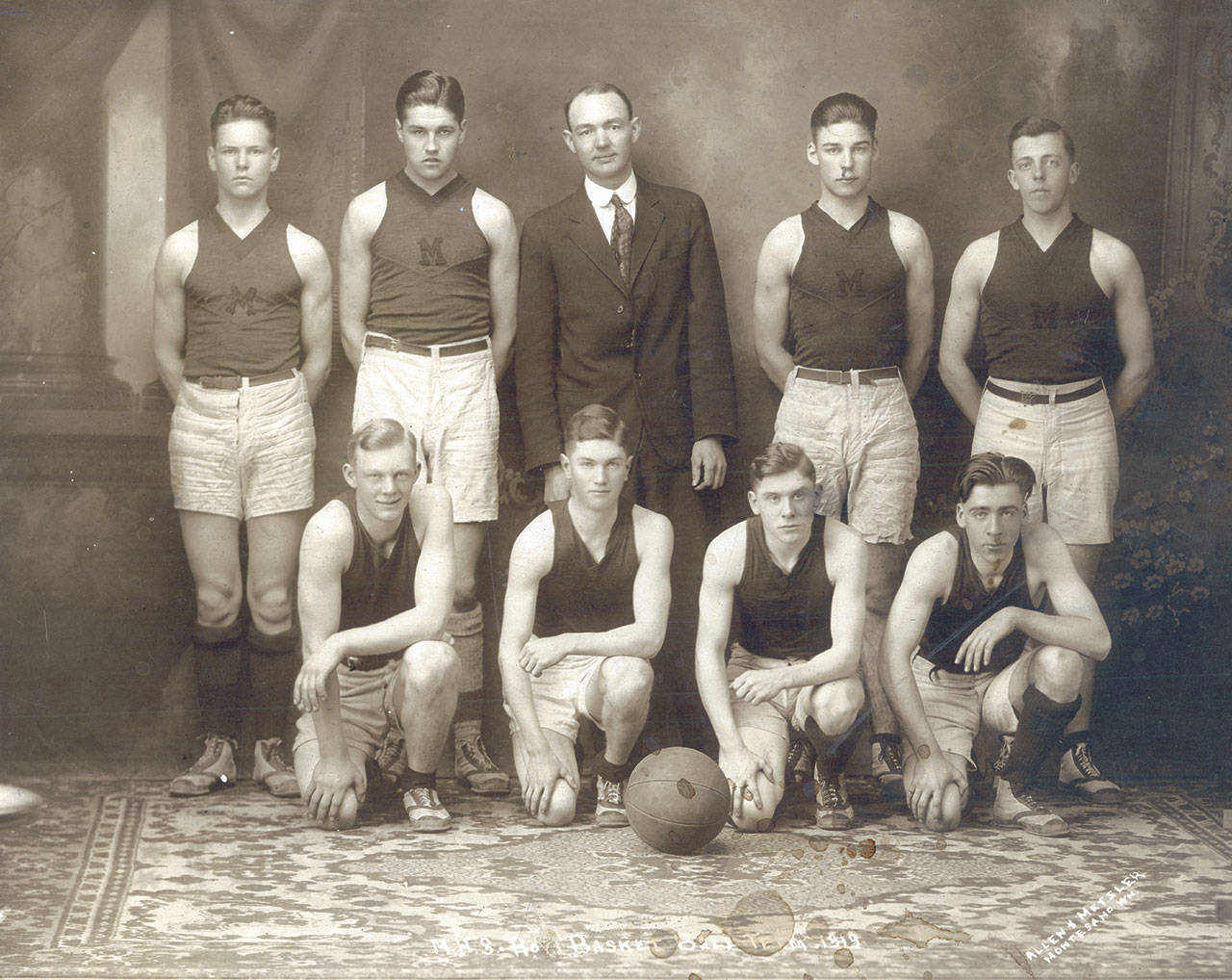 The Vidette archives                                According to the 1919 Sylvan yearbook, the Montesano High School boys basketball team finished the season with six wins, five losses and one tie one hundred years ago. Coach E.L. Maddox is in the center of the back row. Steve Young (back row, second from left) was the captain. Other players listed in the yearbook but not identified in the picture are Fred Abel, Chuck Elfbrandt, Roland France, Robert Hall, Leo Noel, Clinton O’Conner Sam Perkins, George Thompson and Ted Wheeler.