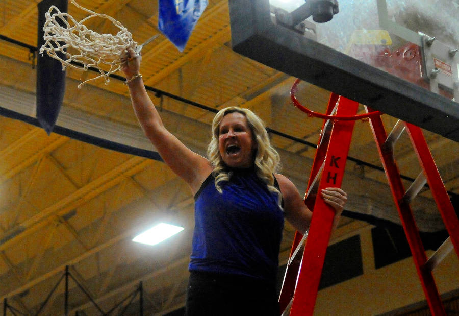 Elma cuts the nets after winning district title