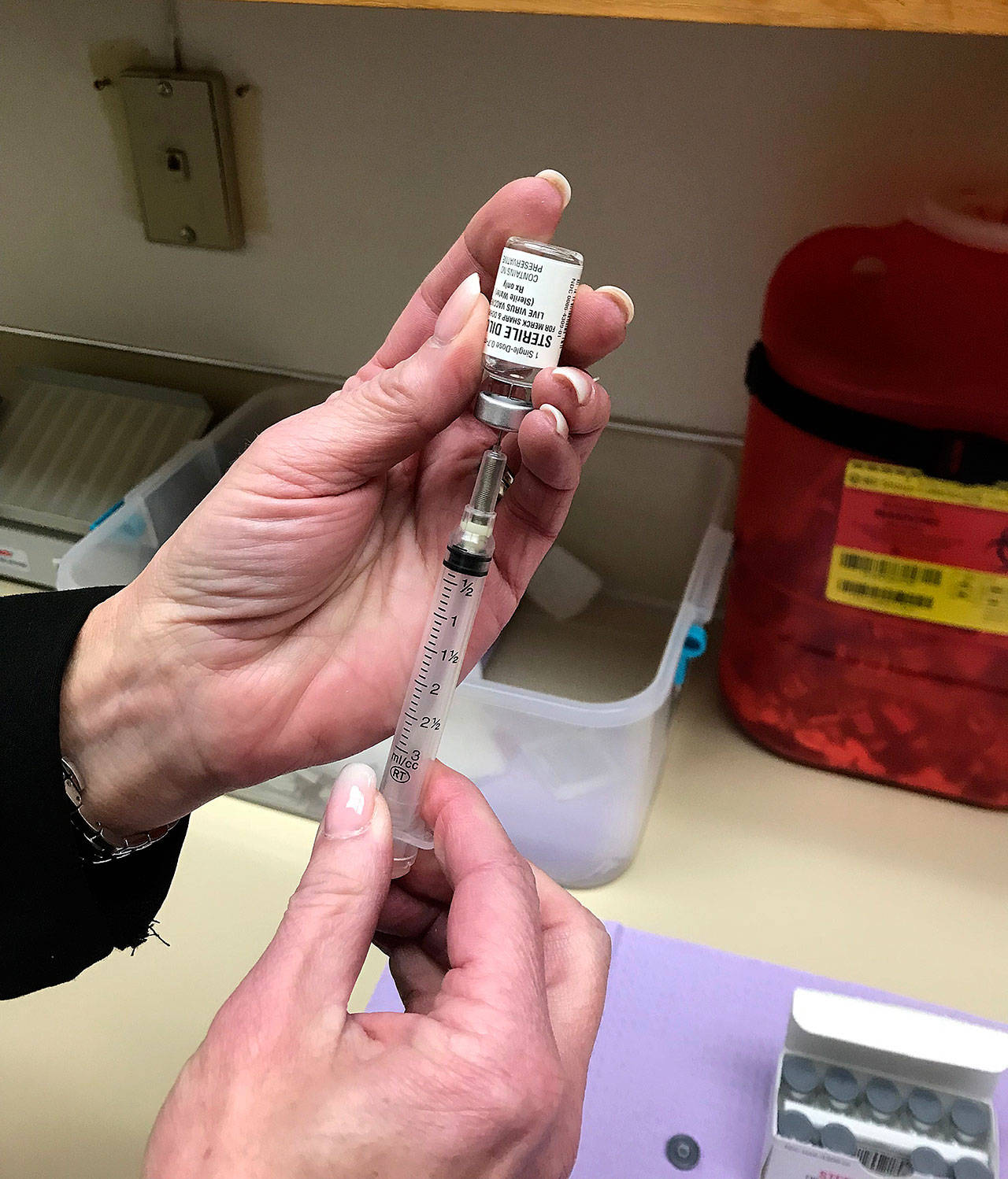 Louis Krauss | Grays Harbor News Group                                A health worker prepares a syringe to be used in vaccinations.