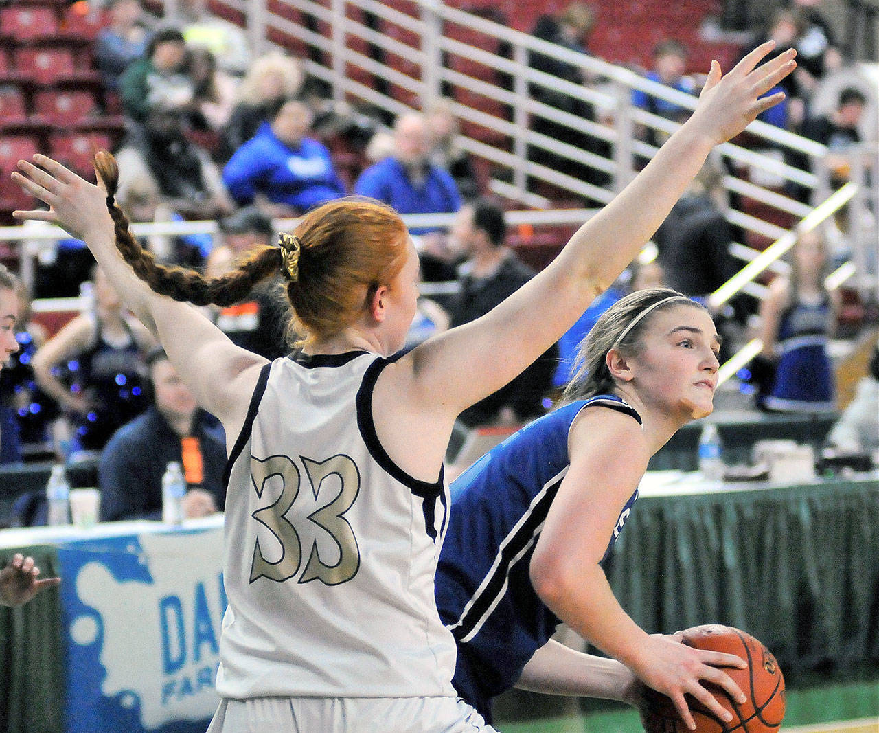 Elma’s Jalyn Sackrider looks to pass out of the post in the third quarter against Meridian on Friday. Sackrider finished the game with a team-leading 18 points in Elma’s 50-47 over the Trojans. (Hasani Grayson | Grays Harbor News Group)