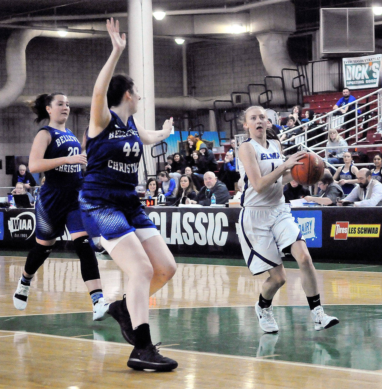 Elma’s Jillian Bieker (right) drives to the hoop while Bellevue Christian’s Samantha Skaggs defends in the third quarter Saturday in Yakima. (Hasani Grayson | Grays Harbor News Group)