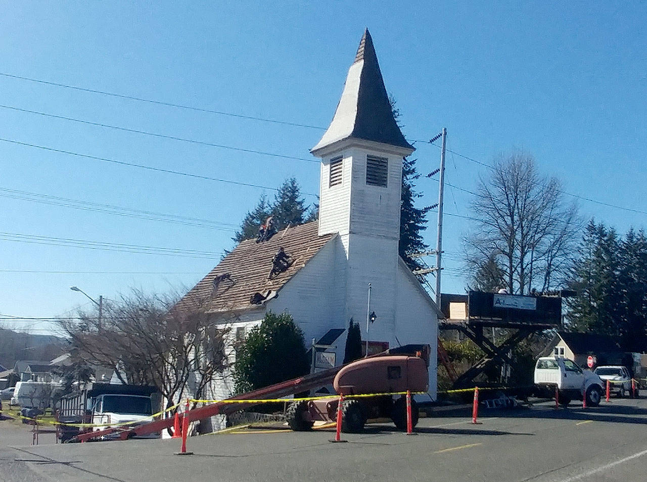 A crew from A-1 Roofing Inc. replaces the roof on the Chehalis Valley Historical Society roof Monday, March 18, in Montesano. The new roof was made possible by $15,000 donations from both Kelsey Foundation and Grays Harbor Community Foundation. Michael Lang | Grays Harbor News Group