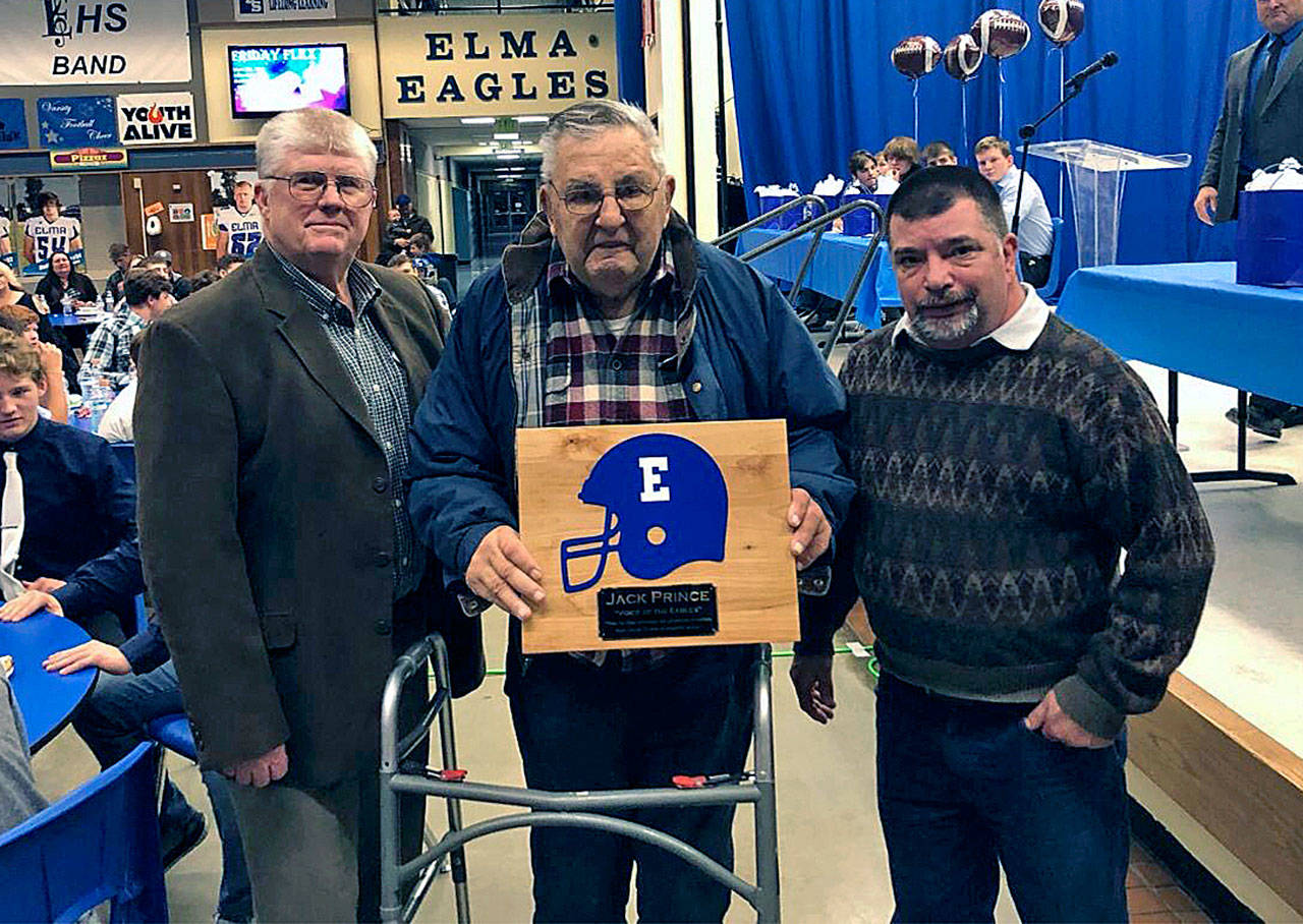 Former Elma High School public address announcer Jack Prince, middle, is flanked by his son, Scott Prince, right, and former Elma Athletic Director Steve Bridge during the Elma High School football banquet in 2018. Jack Prince passed away on March 26. (Submitted photo)