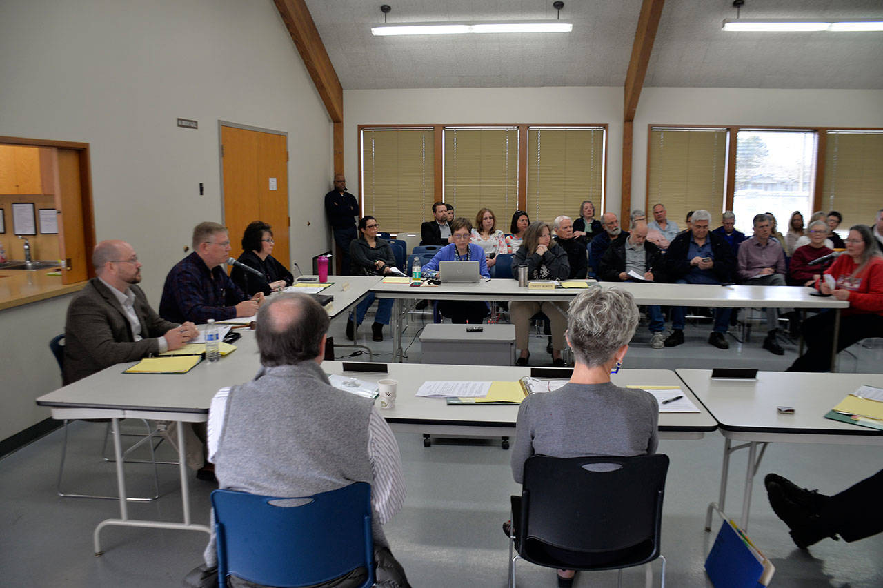 (Louis Krauss | Grays Harbor News Group) On the left, Grays Harbor County Commissioners Wes Cormier, Randy Ross and Vickie Raines listen to public comments on the county syringe exchange which they voted two to one in favor of not canceling the program.