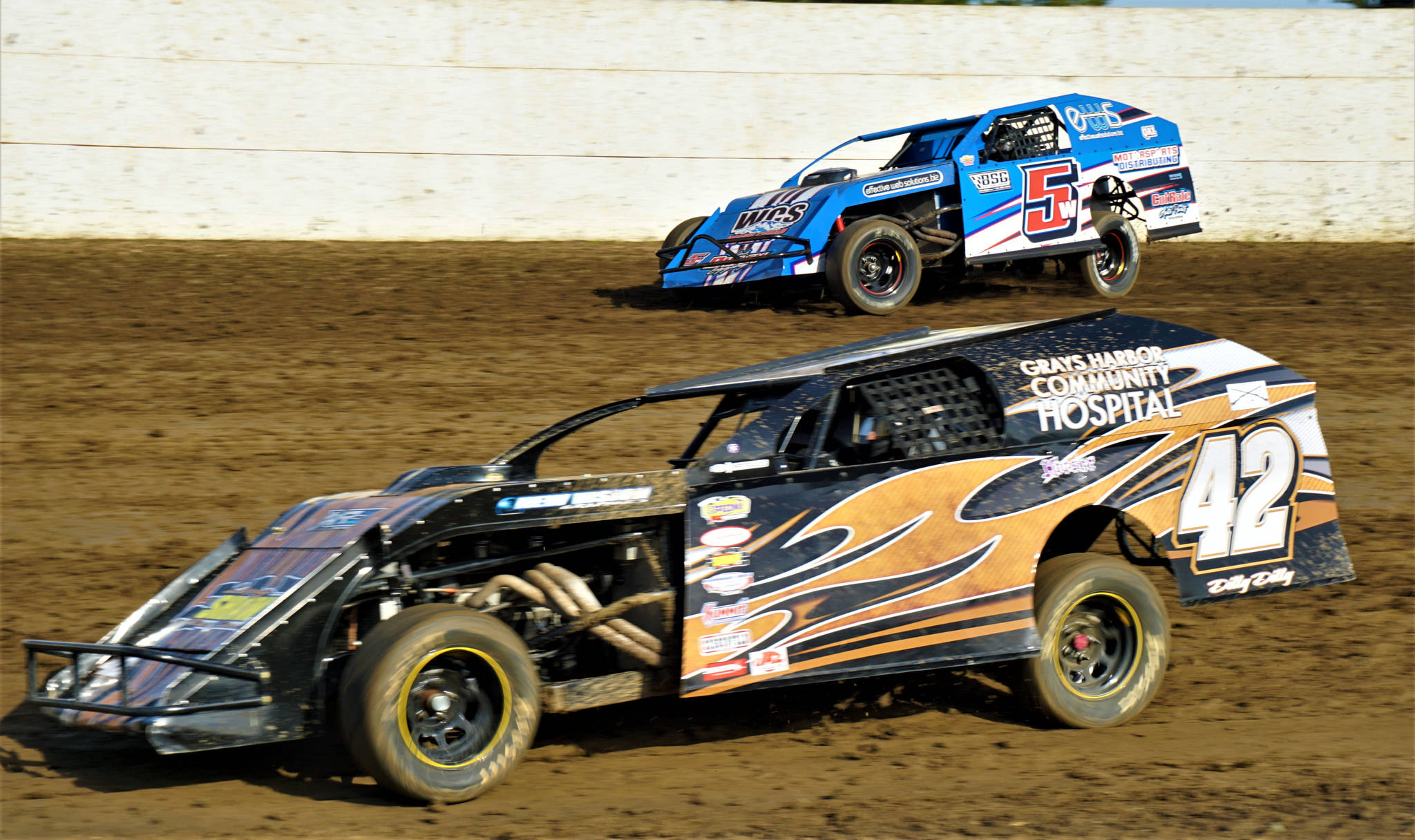 Photo by AR Racing Videos                                Kevin Hanson (42) races against Devan West in the Washington Modifieds Tour on Saturday at Grays Harbor Raceway in Elma.