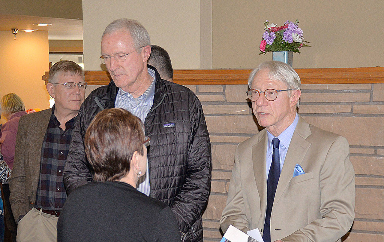 DAN HAMMOCK | GRAYS HARBOR NEWS GROUP                                State Historian John Hughes, right, talks with Channel Point Village Executive Director Maggie Birmingham, foreground, Thursday. Also pictured is Grays Harbor County Commissioner Randy Ross, far left, and Port of Grays Harbor Commissioner Tom Quigg.