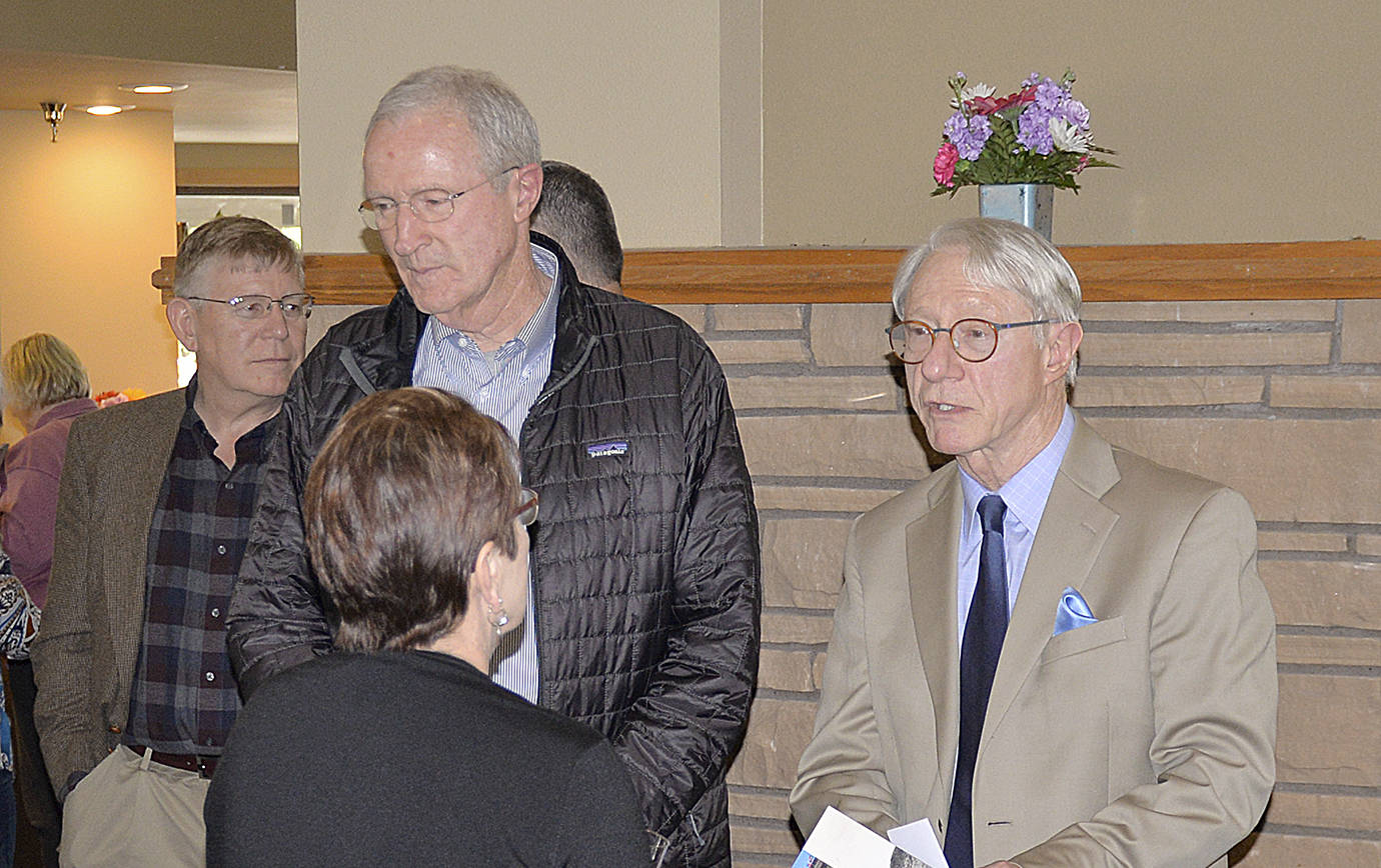 DAN HAMMOCK | GRAYS HARBOR NEWS GROUP                                State Historian John Hughes, right, talks with Channel Point Village Executive Director Maggie Birmingham, foreground, Thursday. Also pictured is Grays Harbor County Commissioner Randy Ross, far left, and Port of Grays Harbor Commissioner Tom Quigg.