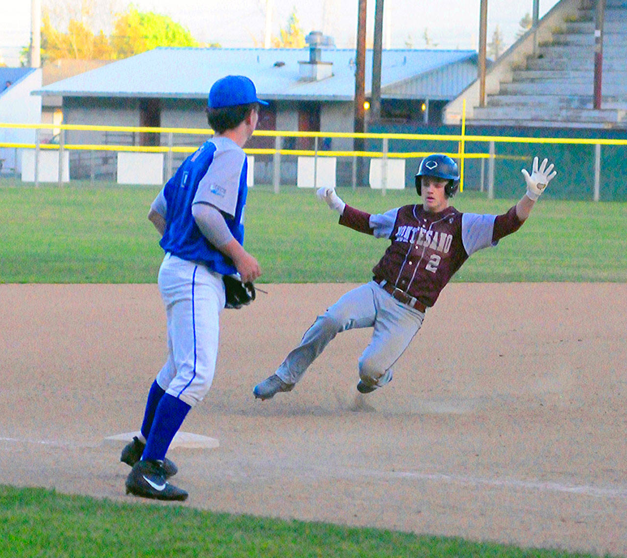 Montesano’s Carter Olson slides into third base for a triple against La Center on Tuesday at Olympic Stadium. (Hasani Grayson | Grays Harbor Newsgroup)