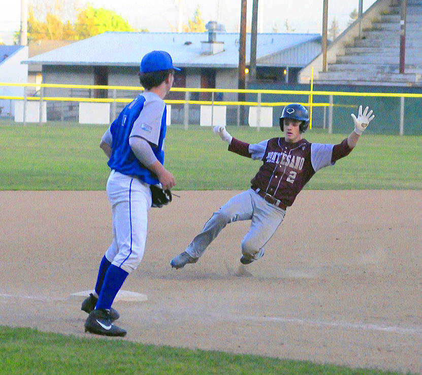 Hasani Grayson | Grays Harbor News Group Montesano’s Carter Olson slides into third base for a triple against La Center on Tuesday at Olympic Stadium.