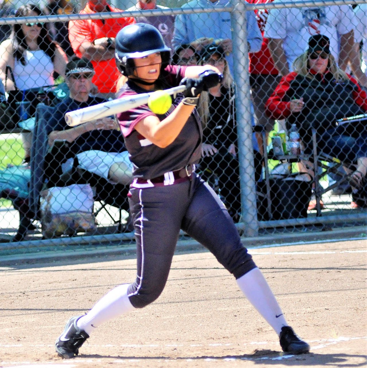 Montesano’s Emma Jensen drives in a run with an RBI single against Castle Rock in the 1A State title game on Saturday in Richland. (Hasani Grayson | Grays Harbor News Group)