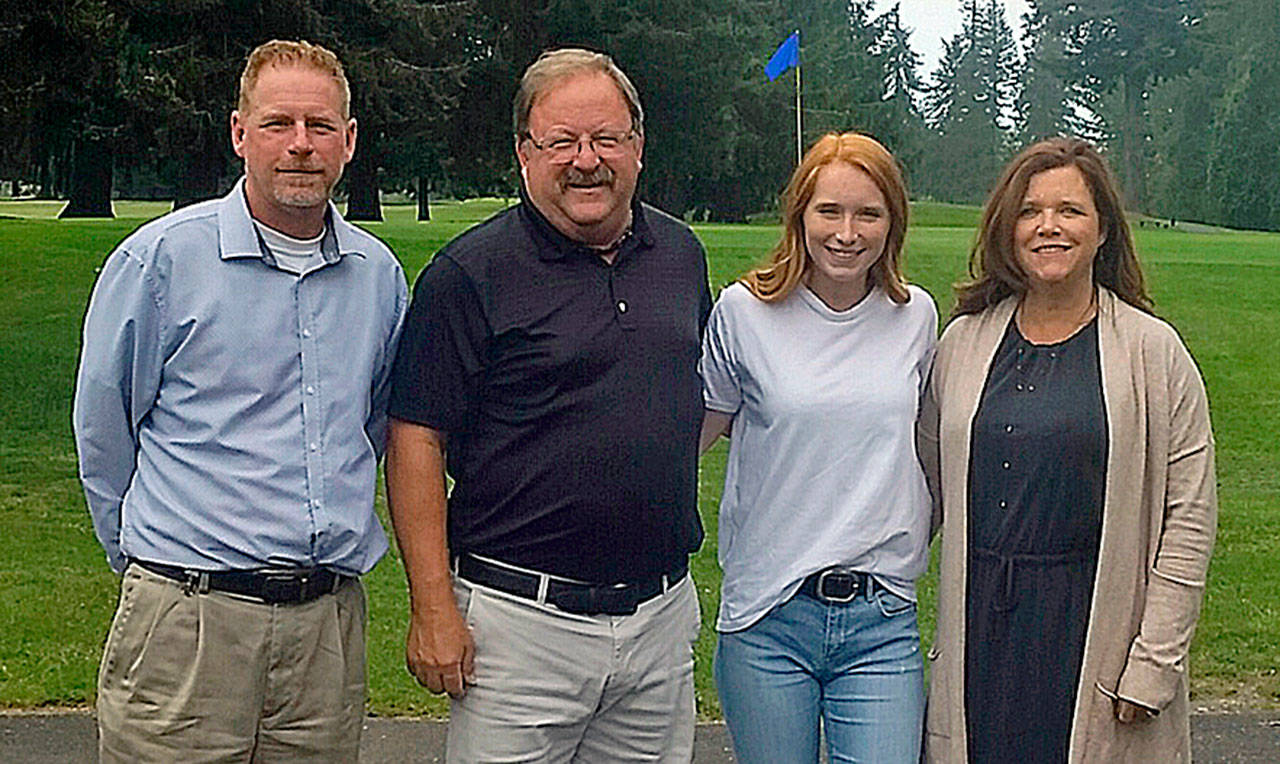 Montesano High School golfer Glory Grubb, second from right, is flanked by, from left, Chris Grubb (father), Grays Harbor women’s golf coach Brian Davis, and Kim Gherna (mother) after Grubb signed a National Letter of Intent to compete for Grays Harbor next season. (Submitted Photo)