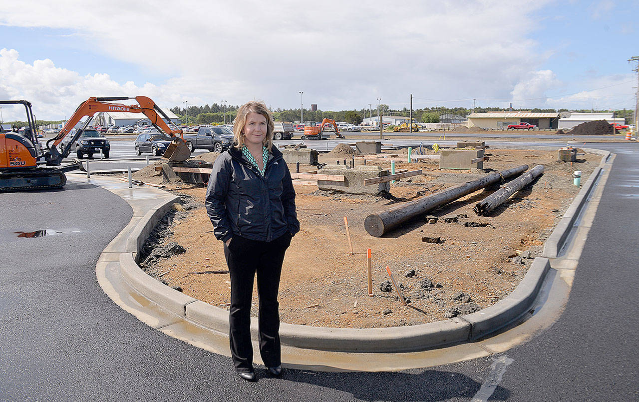DAN HAMMOCK | GRAYS HARBOR NEWS GROUP                                Westport Marina Business Manager Molly Bold stands on the freshly-paved surface of the Westport boat launch parking area.