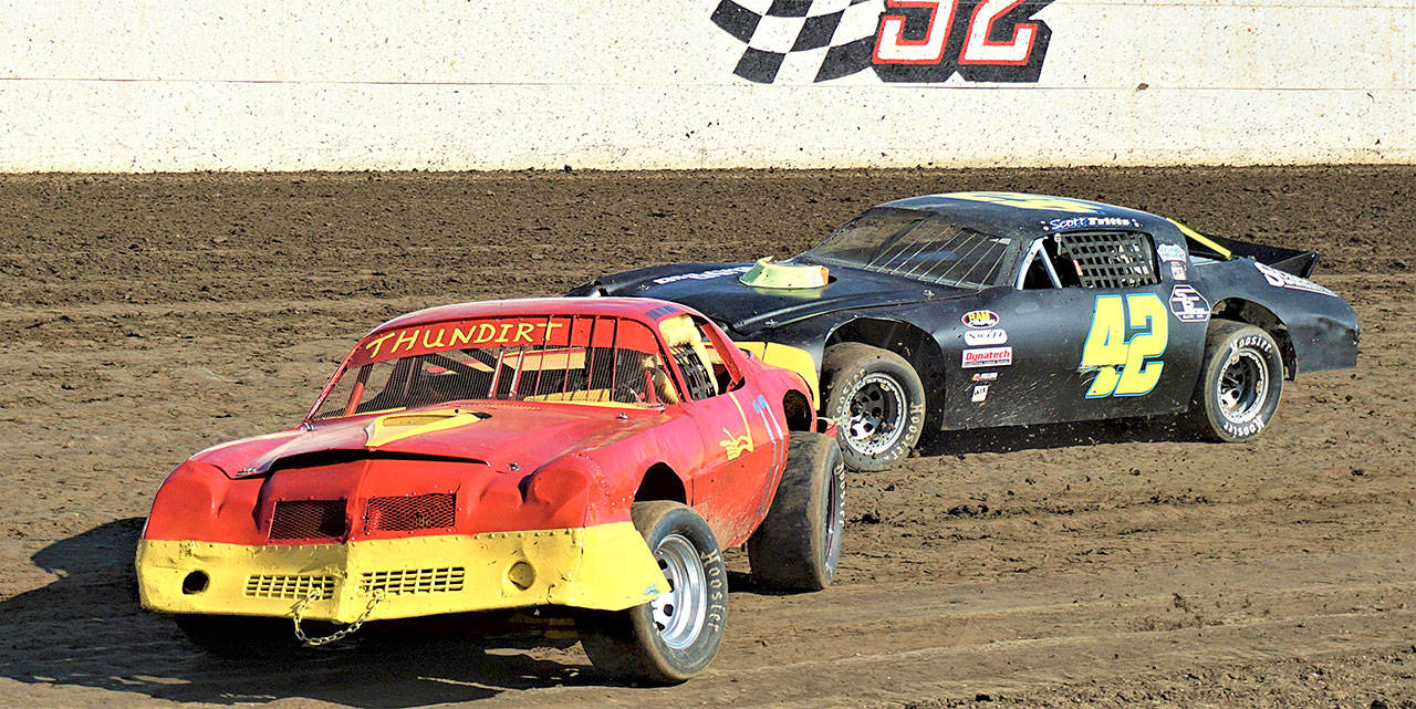 Daryl Brumfield (No. 11) and Scott Fritts (No. 42) battle during Street Stocks racing on Saturday at Grays Harbor Raceway. (Photo courtesy AR Racing Videos)