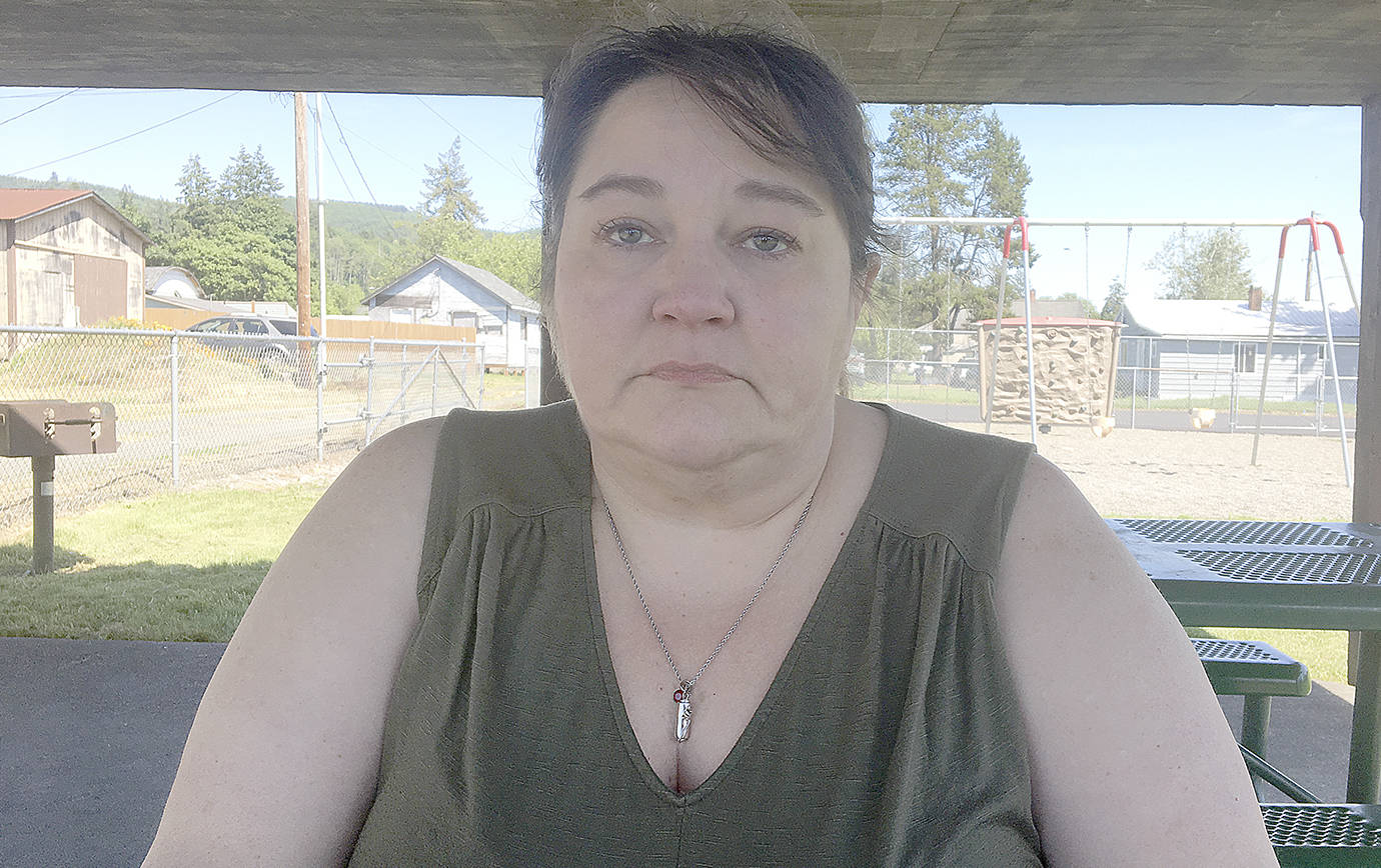 DAN HAMMOCK | GRAYS HARBOR NEWS GROUP                                Melissa Baum wears a pendant containing half of the cremated remains of her daughter, Lindsey Baum. The rest are in a locket given to Lindsey’s brother, Josh.