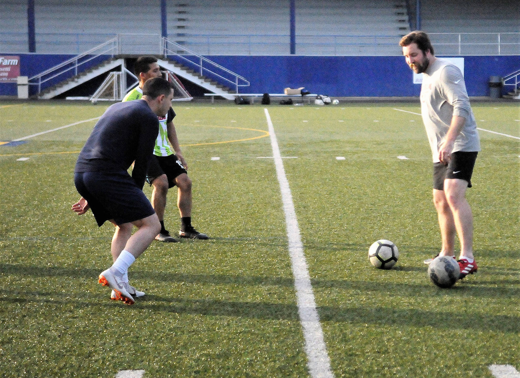 Grays Harbor Gulls head coach Drew Grannemann, right, leads players in a drill in practice on Tuesday. The Gulls are looking to avoid relegation by picking up points in the final three games of the season. (Hasani Grayson | Grays Harbor News Group)