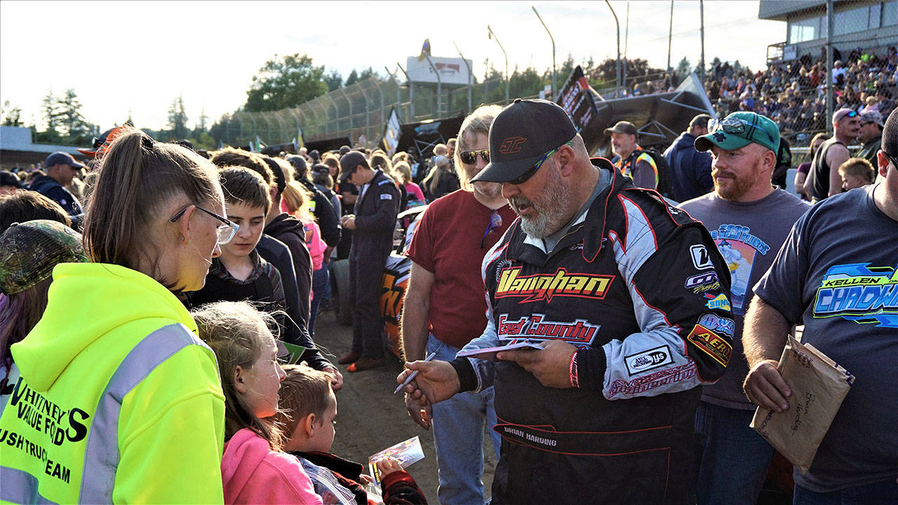 Brian Harding (28 Modified) signs autographs for fans Saturday in Elma. Photo by AR Racing Videos