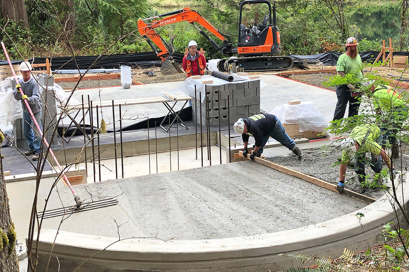 (Photo courtesy Helen Hepp, Friends of Schafer and Lake Sylvia) Workers smooth cement for the foundation of a new pavilion at Lake Sylvia in Montesano. The pavilion is designed to be used year-round. New bathrooms and improvements to accessability also will be constructed.