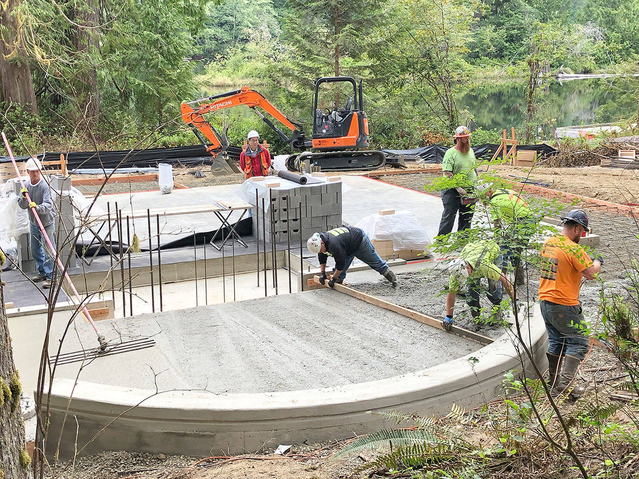 (Photo courtesy Helen Hepp, Friends of Schafer and Lake Sylvia) Workers smooth cement for the foundation of a new pavilion at Lake Sylvia in Montesano. The pavilion is designed to be used year-round. New bathrooms and improvements to accessability also will be constructed.