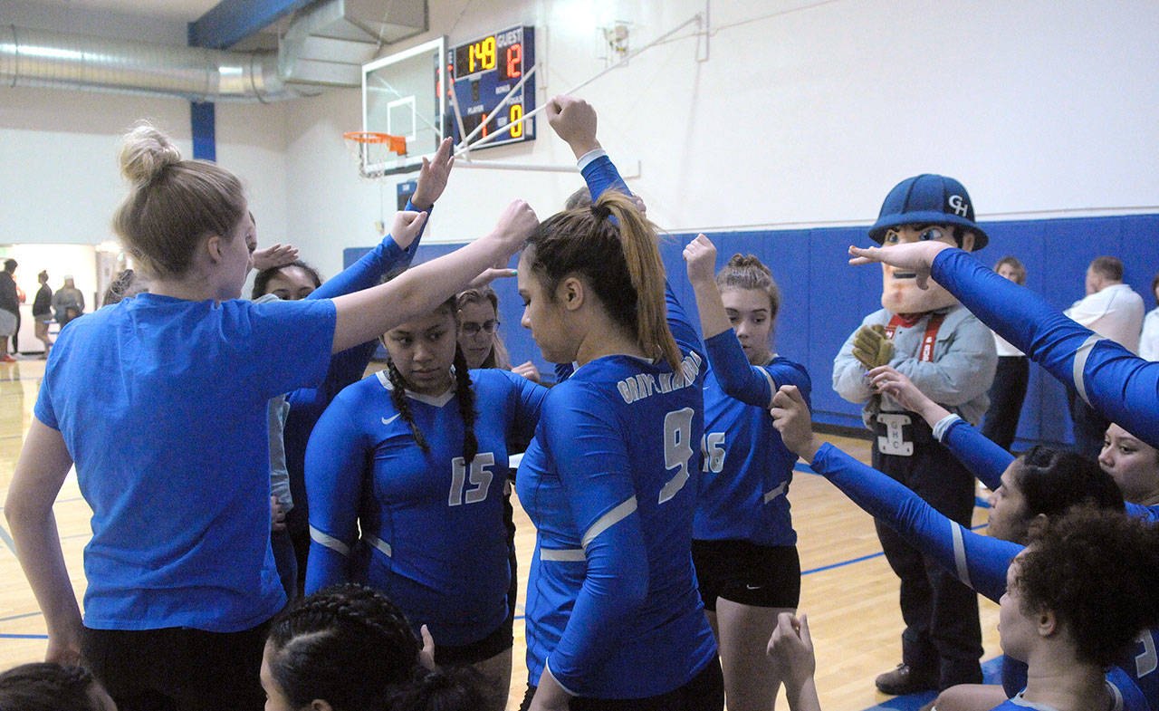 Grays Harbor volleyball players huddle up coming out of a timeout during a match against South Puget Sound Community College on Oct. 17 2018. The program could not fill its head coaching vacancy in a timely fashion and will not play volleyball in the 2019 season as they continue to look for a head coach. (Hasani Grayson | Grays Harbor News Group)