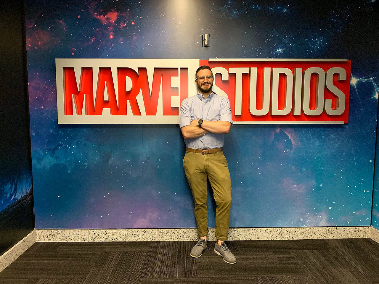 Courtesy Adam Cole                                Adam Cole, a former Montesano resident, poses by a sign at Marvel Studios.