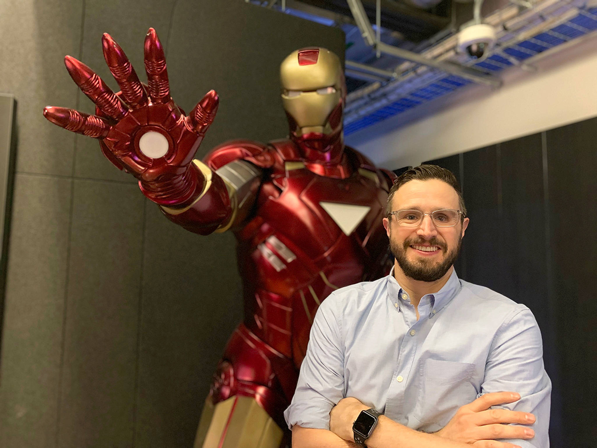 (Courtesy Adam Cole) Posed next to an Iron Man statue at Marvel Studios in Los Angeles, Adam Cole has been a post-production supervisor and coordinator for many of the studios blockbuster movies.