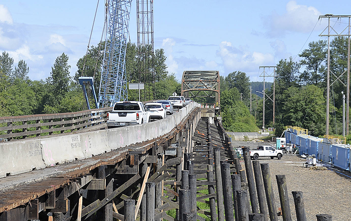 DAN HAMMOCK | GRAYS HARBOR NEWS GROUP The State Route 107 bridge over the Chehalis River south of Montesano is undergoing major repairs. This picture, taken July 18, shows the south approach with the exposed timber trestle that will be removed for replacement by a concrete girder bridge.