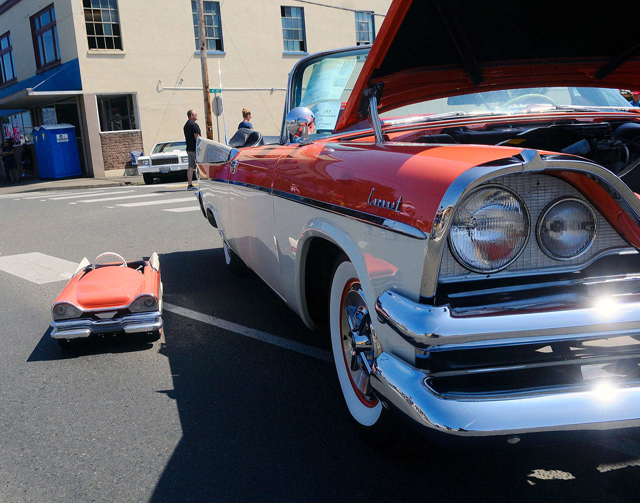 Darryl Tinnerstet’s classic Chevy sits next a smaller scale version of the same car at Heat on the Street in Elma on Saturday.