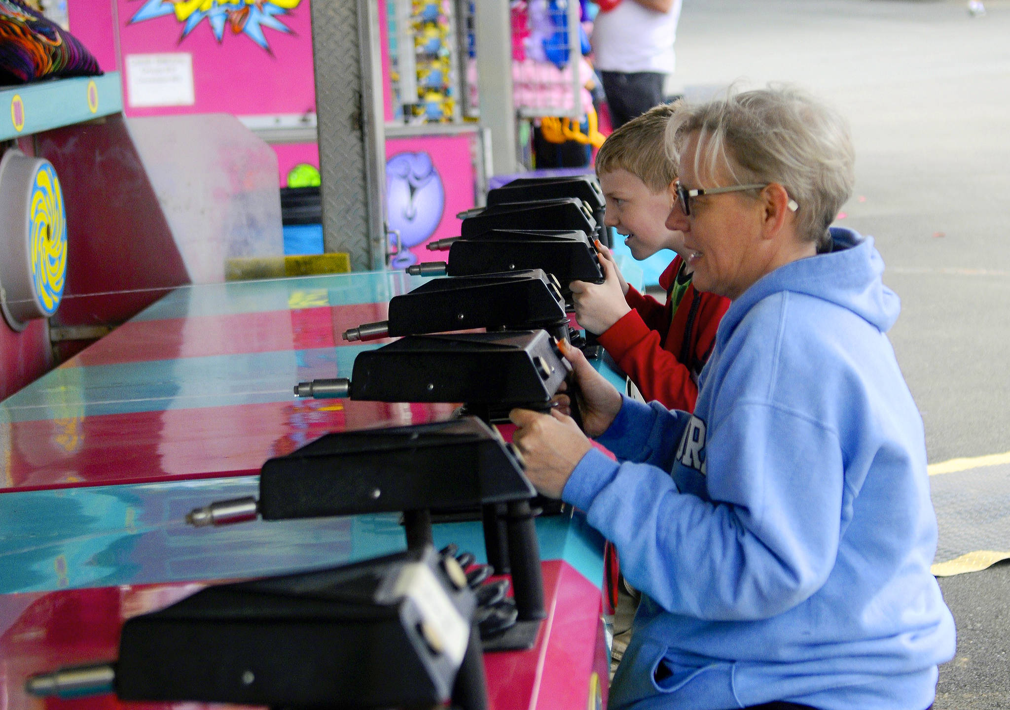 Hasani Grayson | Grays Harbor News Group                                Liam Phillips and Julie Phillips play a midway game at the Grays Harbor County Fair on Wednesday.