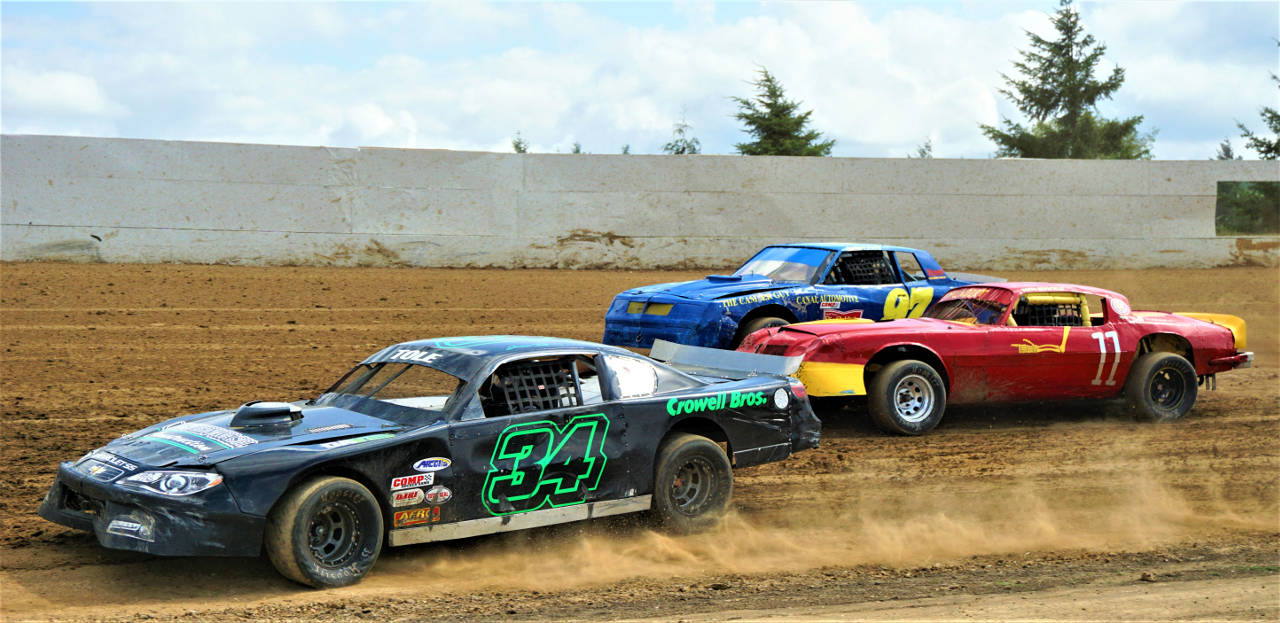 Jason Tole (34), Daryl Brumfield (11) and Rodgery Perry (97) jostle for position during Saturday’s action at the Grays Harbor Raceway in Elma. (Photo by AR Racing Videos)