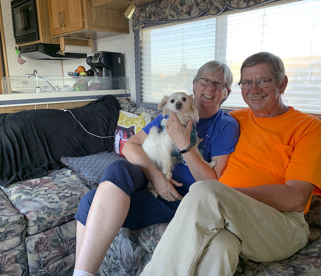 Kat Bryant | Grays Harbor News Group                                Glenn and Charlcie Koster relax in their Pace Arrow RV with Walker on the evening before the final day of Glenns walk. They spent that night in the Walmart parking lot in Aberdeen.