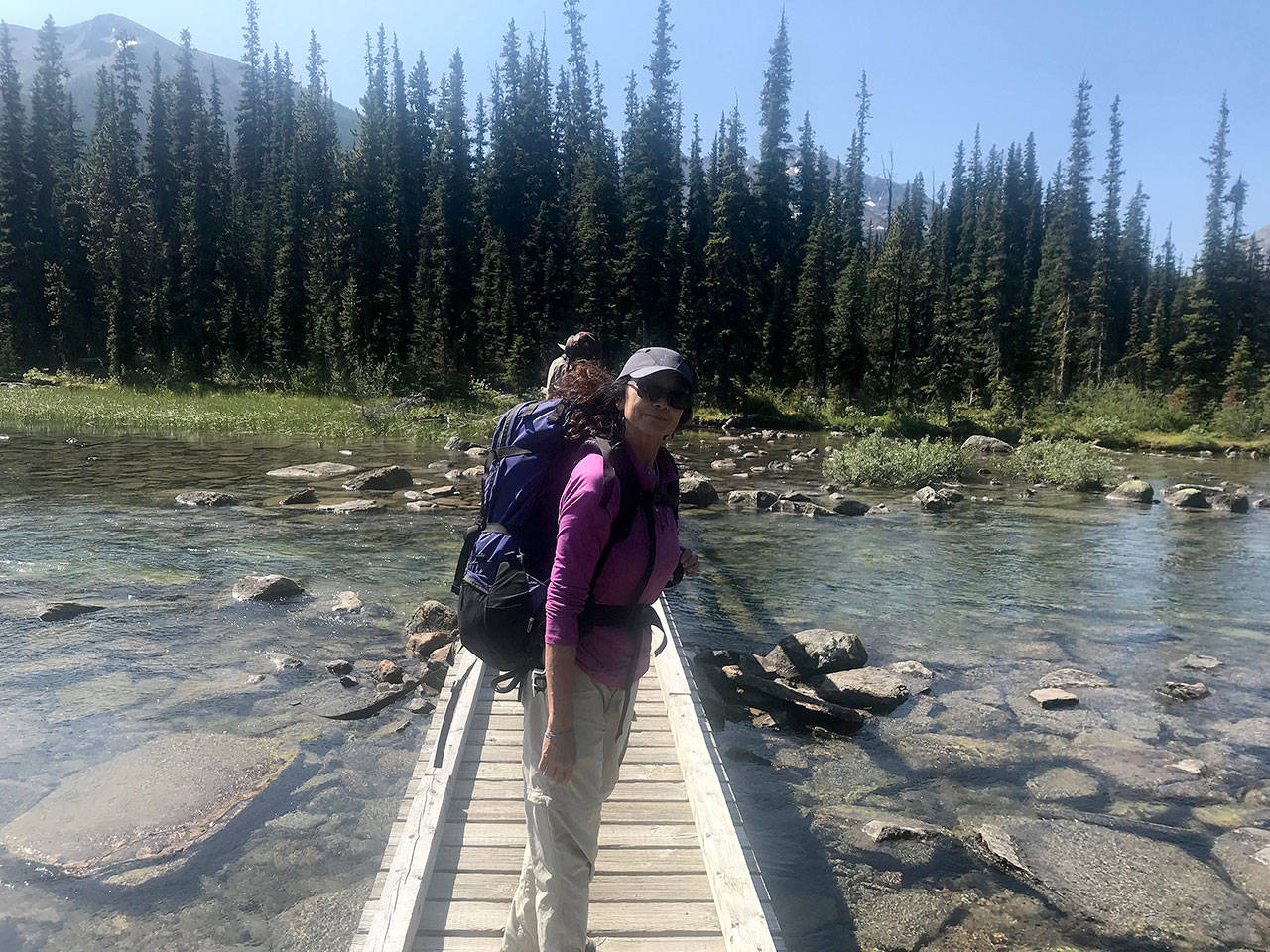 Photos by Louis Krauss | Grays Harbor News Group                                The author’s mother, Fern Shen, crosses the bridge at Shadow Lake in Banff National Park.