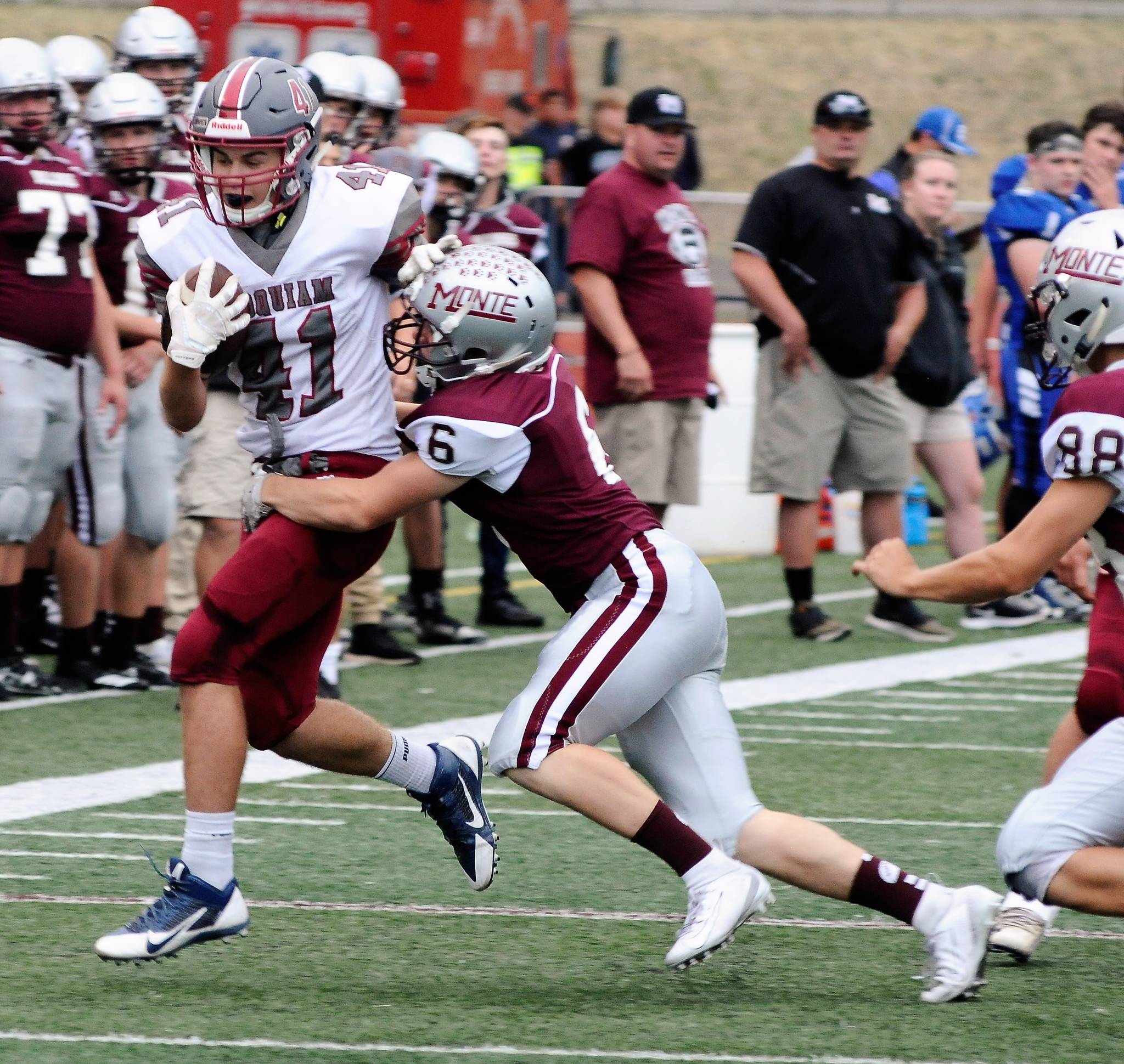 Hoquiam’s Ben Estes is run out of bounds by Montesano’s Hunter Schnoor at the Jamboree in Montesano on Friday.(Hasani Grayson | Grays Harbor News Group)