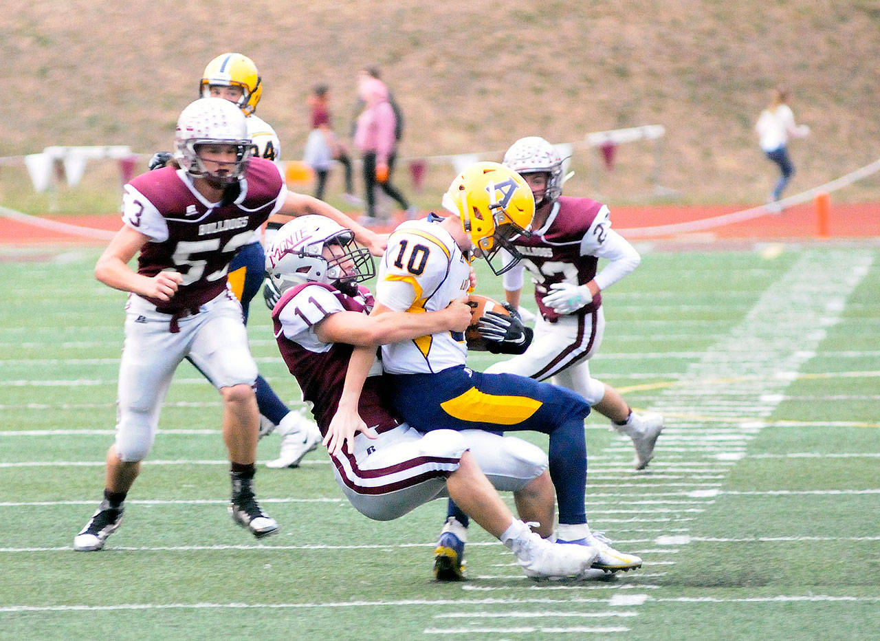 Montesano’s Brent Hollatz (11) sacks Aberdeen quarterback Cody Bemis (10) in the first quarter on Friday at Jack Rottle Field in Montesano. (Hasani Grayson | Grays Harbor News Group)