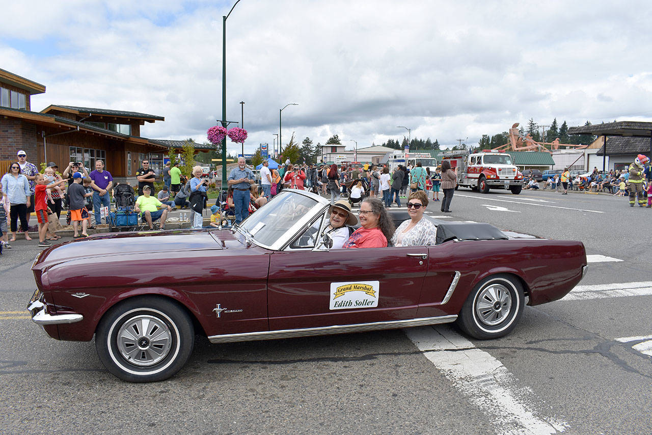 Courtesy photo                                McCleary Bear Festival grand marshall Edith Soller (seated in passenger seat) rides by during July’s parade in McCleary.
