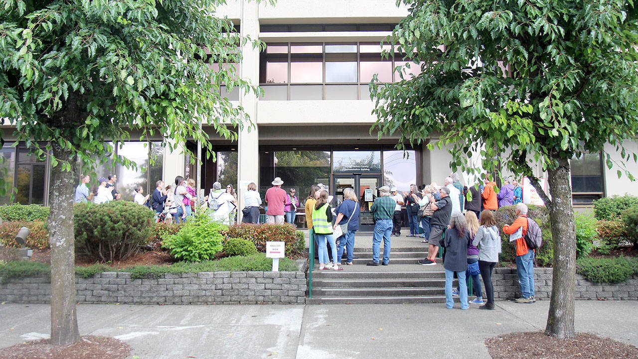 Harborites take part in a climate demonstration Friday, Sept. 20, in front of the county administration building in Montesano as part of a global climate strike. (Michael Lang | Grays Harbor News Group)