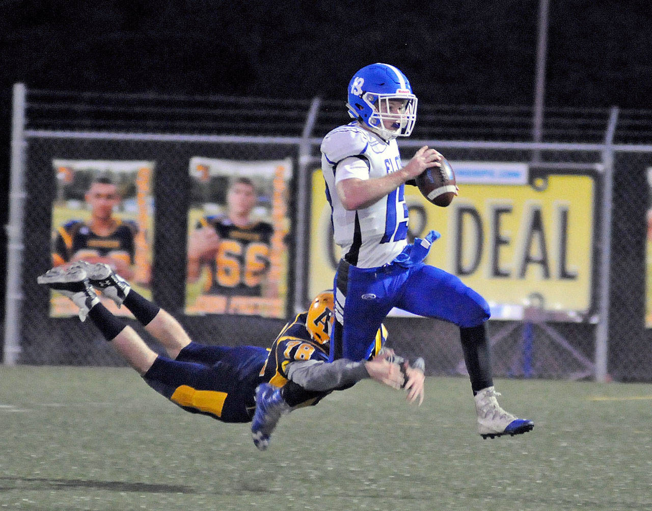 Ryan Sparks | Grays Harbor News Group                                Aberdeen’s Seth Brown, left, chases down Elma quarterback Cody Vollan in the first half of Friday’s game at Stewart Field.