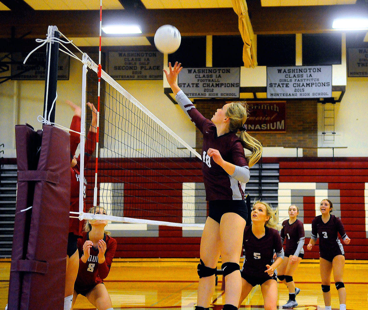 Montesano’s Jessica Stanfield tips a ball over the net in the third set of a match against Hoquiam on Tuesday in Hoquiam. (Hasani Grayson | Grays Harbor News Group)