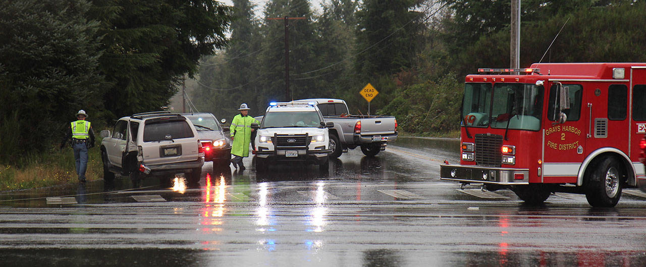 Two vehicles, including this gray Toyota 4Runner (left), collided Thursday, Oct. 3, 2019, west of Montesano at the intersection of Clemons Road and U.S. Highway 12. Multiple agencies responded to the scene. One person was reported as injured, but additional information was not available Thursday afternoon. (Michael Lang | Grays Harbor News Group)