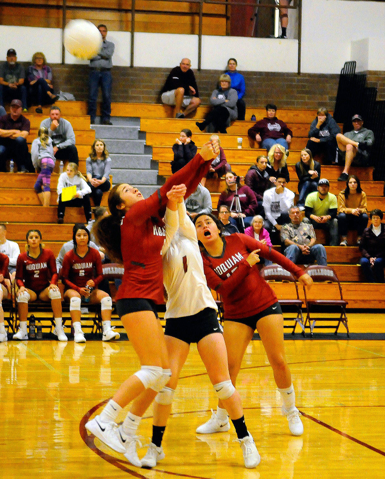 Hoquiam’s Maggie Mazariegos and Hailey Lawerence come together to dig out a shot in the fourth set of a match against Montesano. (Hasani Grayson | Grays Harbor News Group)