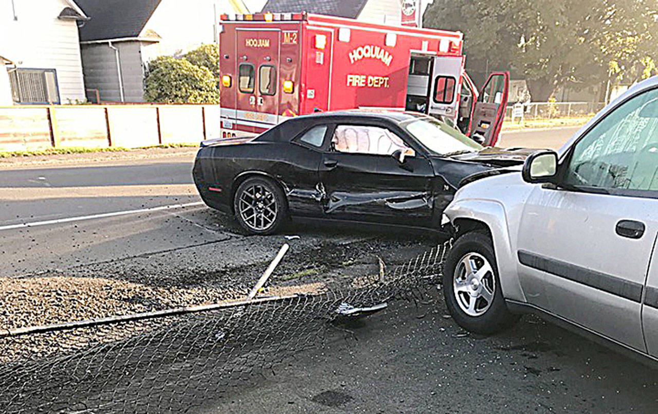 COURTESY HOQUIAM POLICE DEPARTMENT                                A Dodge Charger driven by a 19-year-old Hoquiam man crashed through the fence at Hot Rod Alley on Simpson Avenue on the morning of Oct. 10, damaging the Challenger and six cars in the lot.