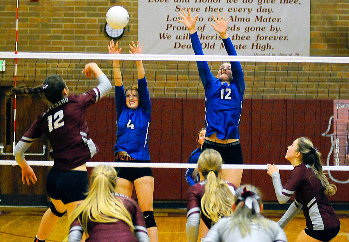 Elma’s Hannah Warren (4) and Jalyn Sackrider go up for a block on Montesano’s McKynnlie Dalan shot in the second set of a match on Thursday. (Hasani Grayson | Grays Harbor News Group)