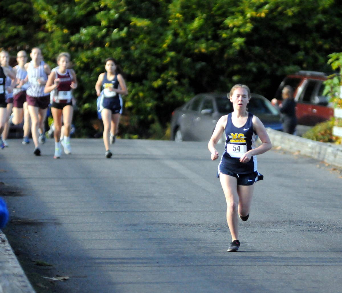 Forks’ Madelyn Archibald crosses the Lake Sylvia Bridge during the 1A Evergreen League Championship Meet on Thursday in Montesano. Archibald won the league title with a time of 21:36. (Ryan Sparks | Grays Harbor News Group)